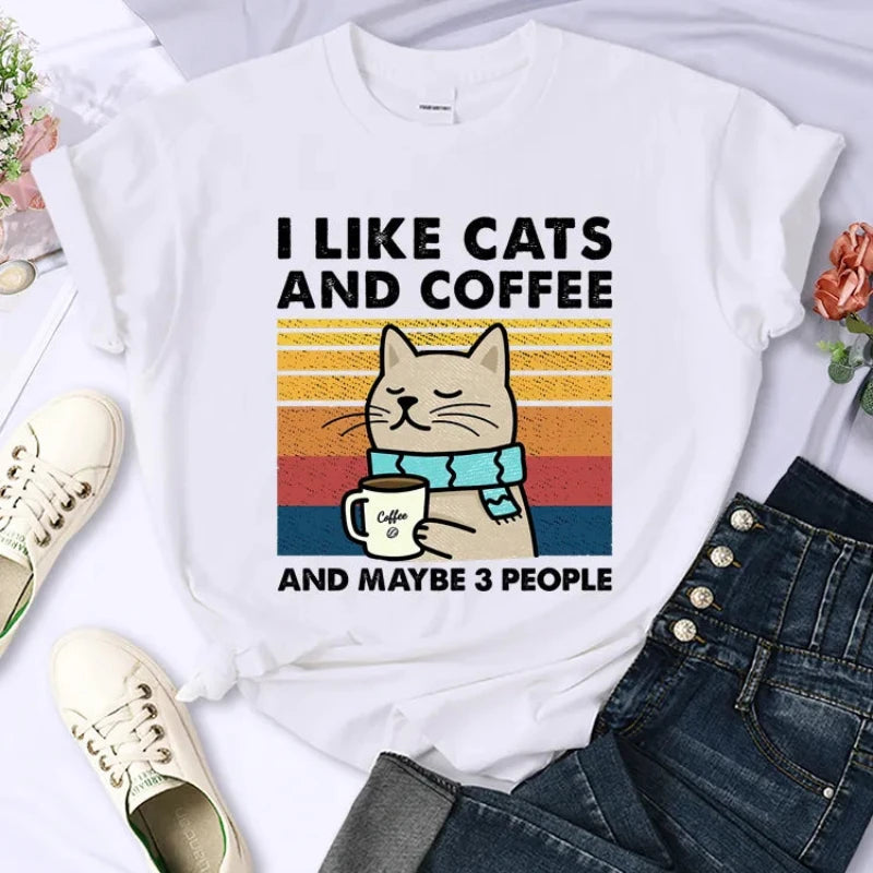 Stack of cat-themed T-shirts ready for purchase