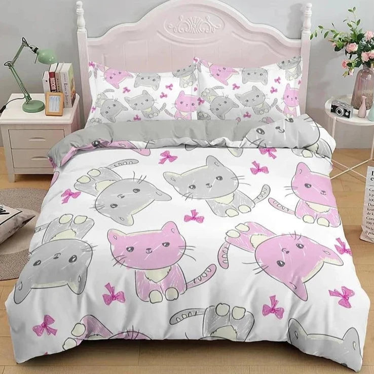 The bedding set features a charming pattern of pink and gray cats, interspersed with pink butterfly motifs, creating a whimsical and cheerful design ideal for a child's bedroom.