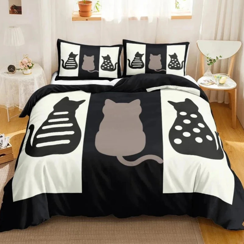 Bedding set features a striking design with black and white cat silhouettes in various poses on both the duvet cover and pillows. The large central cat silhouette is flanked by two profile views showing stylized skeletal and polka dot patterns, creating a modern and artistic look ideal for cat enthusiasts and those who appreciate bold, graphic decor in their sleeping space.