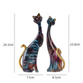 Modern art inspired cat statues in vivid colors, showcasing unique craftsmanship.